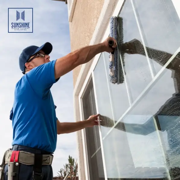 Man Cleaning a Window